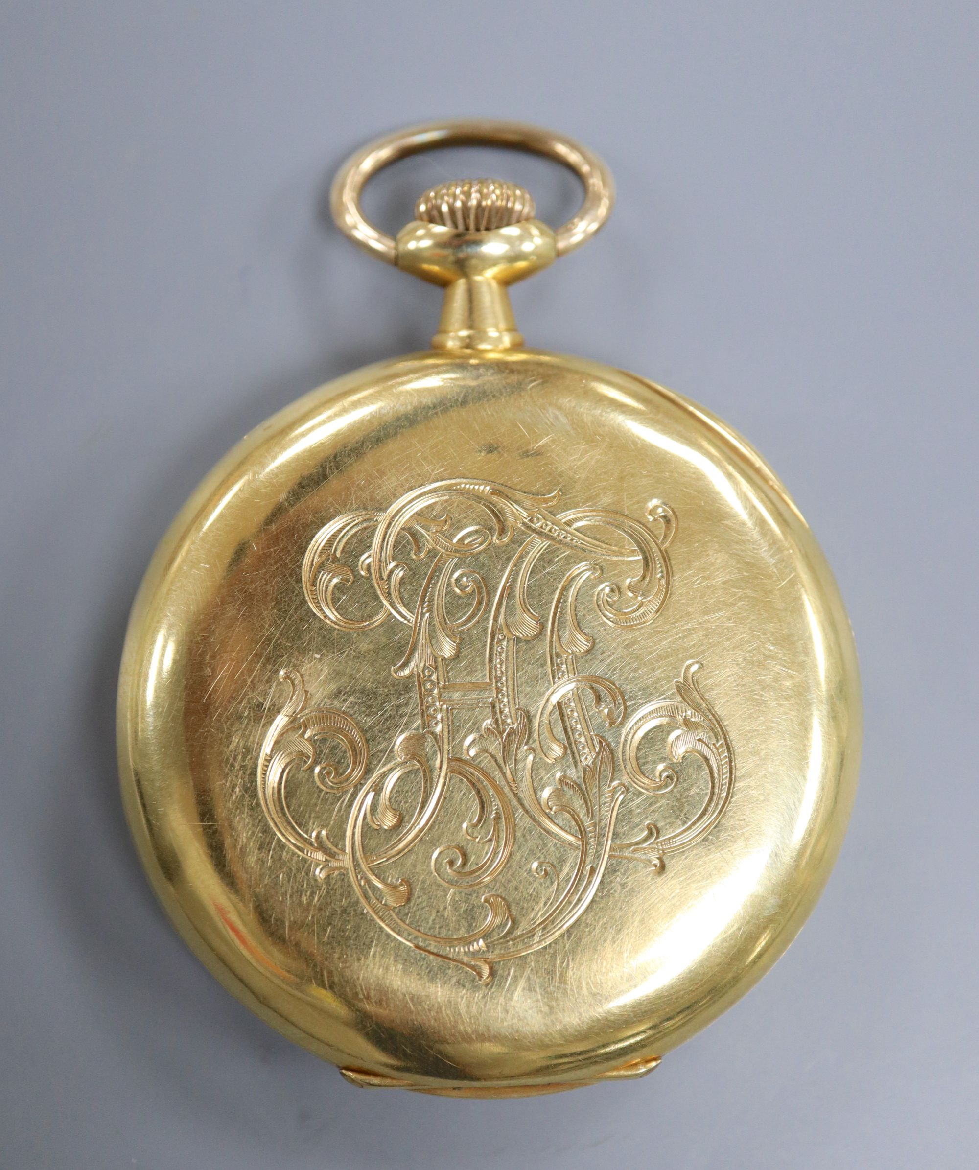 A continental 18k yellow metal open face pocket watch, with Arabic dial and subsidiary seconds,